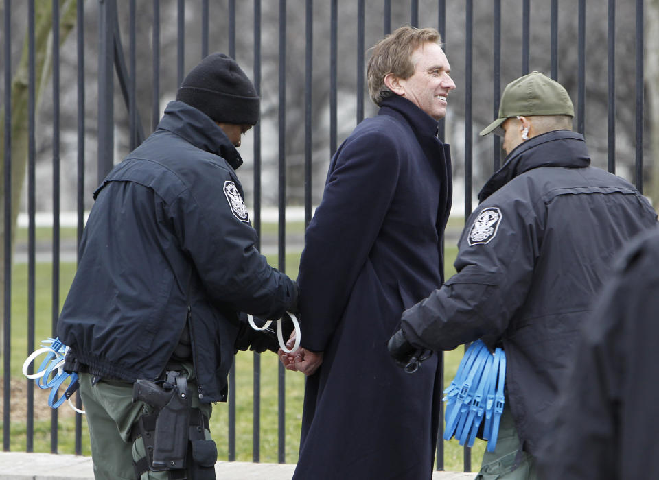 FILE - Robert F. Kennedy, Jr., is arrested in Washington on Wednesday, Feb. 13, 2013, as prominent environmental leaders tied themselves to the White House gate to protest the Keystone XL oil pipeline. Kennedy carved out a career as a bestselling author and top environmental lawyer before becoming a leader in the anti-vaccine movement. (AP Photo/Ann Heisenfelt, File)