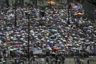 Thousands of pro-democracy protesters gather to march in the streets to demand universal suffrage in Hong Kong July 1, 2014. REUTERS/Tyrone Siu