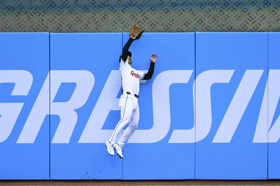 Cleveland Guardians' Steven Kwan catches a fly ball hit by Oakland Athletics' Max Schuemann during the second inning of a baseball game Saturday, April 20, 2024, in Cleveland. (AP Photo/Nick Cammett)