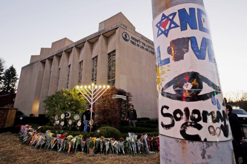 A menorah at a memorial outside the Tree of Life synagogue in Pittsburgh in 2018, after 11 worshipers were slaughtered by a man wielding an AR-15 assault-style rifle and three handguns.