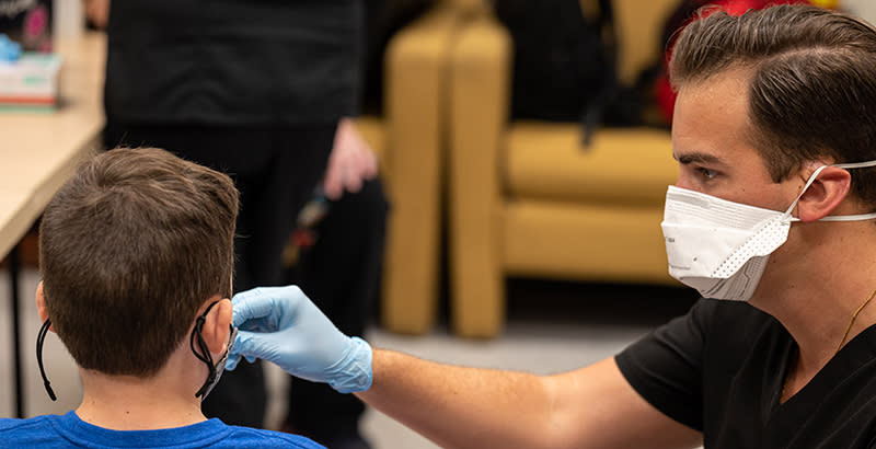 A student at Brandeis Elementary School in Louisville, Kentucky, is tested for COVID-19. (Jon Cherry / Getty Images)<br>