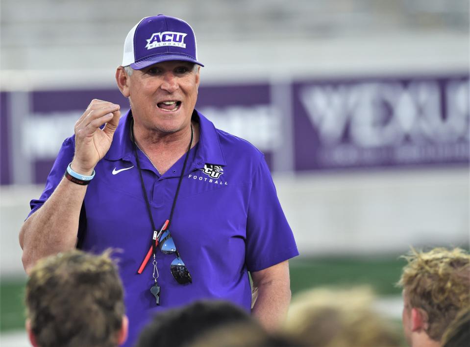 First-year ACU coach Keith Patterson talks to his football team after the annual spring game April 9 at Wildcat Stadium.