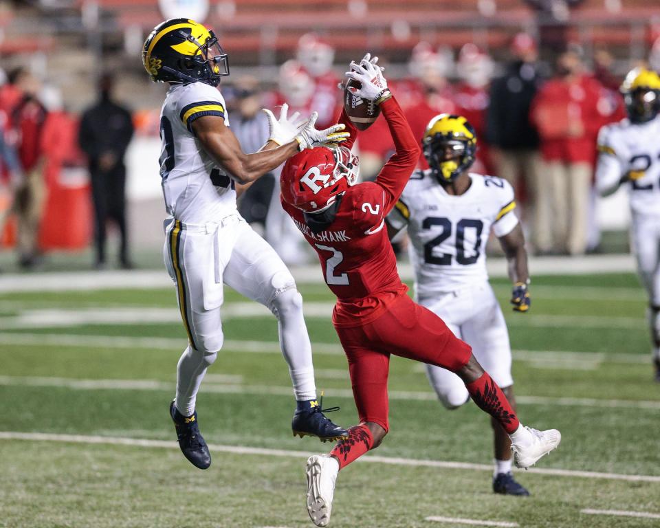 Rutgers Scarlet Knights wide receiver Aron Cruickshank (2) catches the ball against Michigan Wolverines defensive back Daxton Hill (30) during the first half at SHI Stadium.