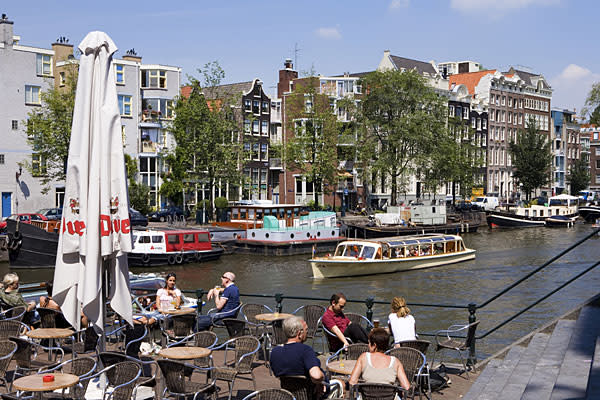 <h2><b>4. Netherlands</b> <br>Highest income tax rate: 52% <br> Average 2010 income: $57,000 </h2><br><br>Holland's highest tax rate of 52 percent is much higher than the regional average of 45.7 percent in Western Europe. <br><br>The country’s top marginal tax rate kicks in at about $74,500 of taxable income. Annual property taxes generally range between $470 and $800. Other notable taxes include a capital gains tax of 25 percent, a land transfer tax of 6 percent and an inheritance tax that varies between 10 percent and 40 percent. <br><br>The Netherlands, which has been in recession since July, <a href="http://www.reuters.com/article/2012/04/26/dutch-politics-budget-idUSL6E8FQI7D20120426" rel="nofollow noopener" target="_blank" data-ylk="slk:announced a budget deal;elm:context_link;itc:0" class="link ">announced a budget deal</a> in April for 2013 that will freeze the incomes of civil servants for two years to save the government $3 billion by the end of 2013. Tax deductions for employee travel between work and home will also be reduced to save $1.58 billion, along with the raising of retirement age from 65 to 67 to grapple with the country’s ballooning pension bill. Dutch government figures estimate that the overall effect of the tax increases and pay freeze will reduce consumer spending by 3 percent in 2013. <br><br>Pictured: Amsterdam