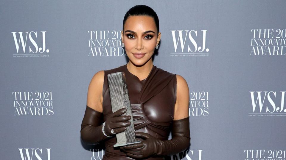 Kim Kardashian West poses with an award during the WSJ. Magazine 2021 Innovator Awards sponsored by Samsung, Harry Winston, and Rémy Martin