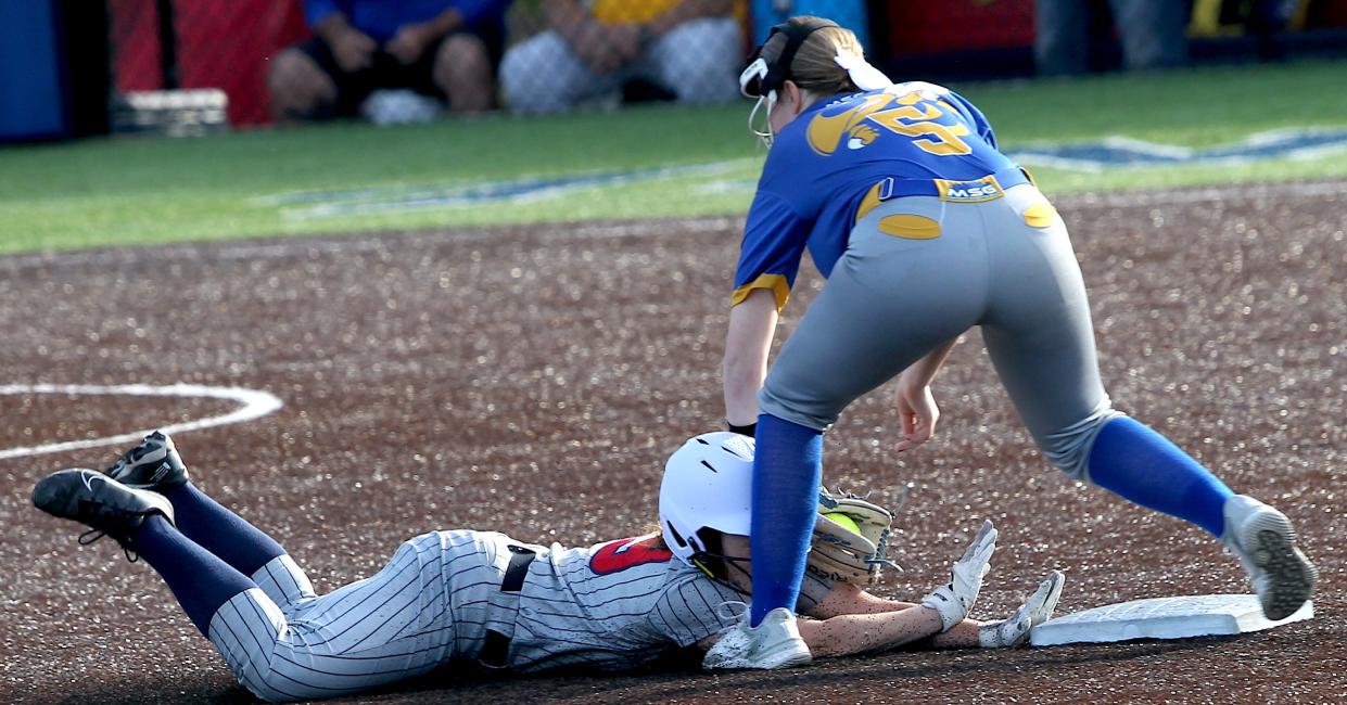 Mitchell's Davaney Roop (5) get the out at second base on BNL's Lexy Niemi (29).