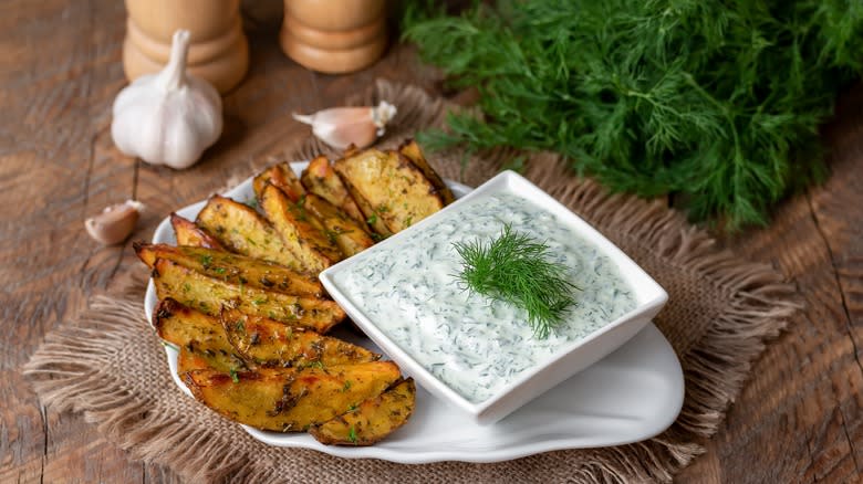 plate of tzatziki and fries