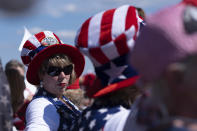 Tonia Garrett sports a flag hat while waiting with friends for the start of former president Donald Trump's Save America rally in Perry, Ga., on Saturday, Sept. 25, 2021. (AP Photo/Ben Gray)