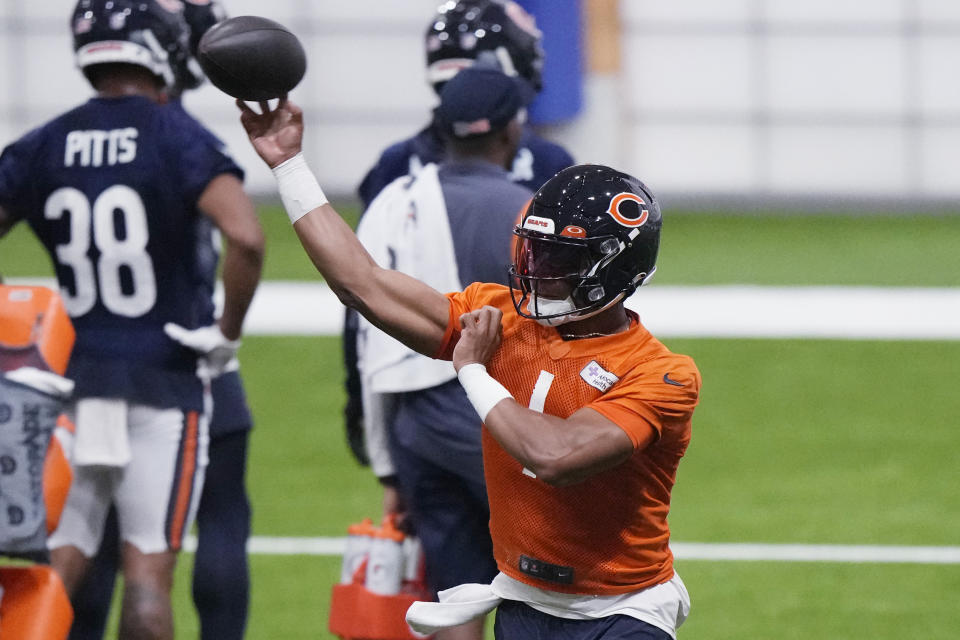 Chicago Bears quarterback Justin Fields throws a ball at the NFL football team’s training camp in Lake Forest, Ill., Wednesday, July 26, 2023. (AP Photo/Nam Y. Huh) ORG XMIT: ILNH109