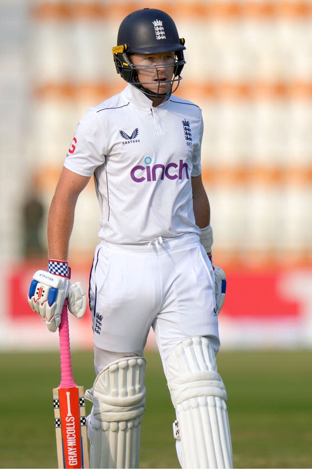 England’s Ollie Pope reacts as he walks off the field after his dismissal