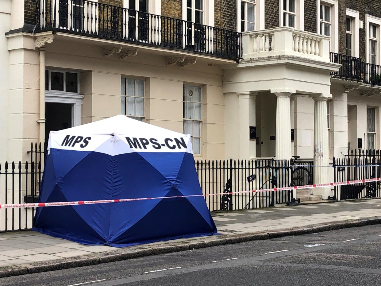 A Met Police tent, often used at crime scenes, has been erected on Taviton Street
