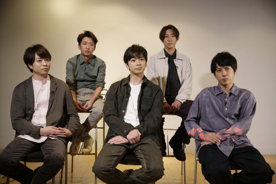 Members of Japanese pop music band ARASHI listen to a question during an interview with The Associated Press in Tokyo on Thursday, Sept. 17, 2020. Back row, from left, clockwise, are Satoshi Ohno, Masaki Aiba, Kazunari Ninomiya, Jun Matsumoto and Sho Sakurai. Japanese pop sensation Arashi has a big surprise for fans as they near their planned hiatus at year's end: a collaboration with Bruno Mars on their first all-English single. (AP Photo/Hiro Komae)