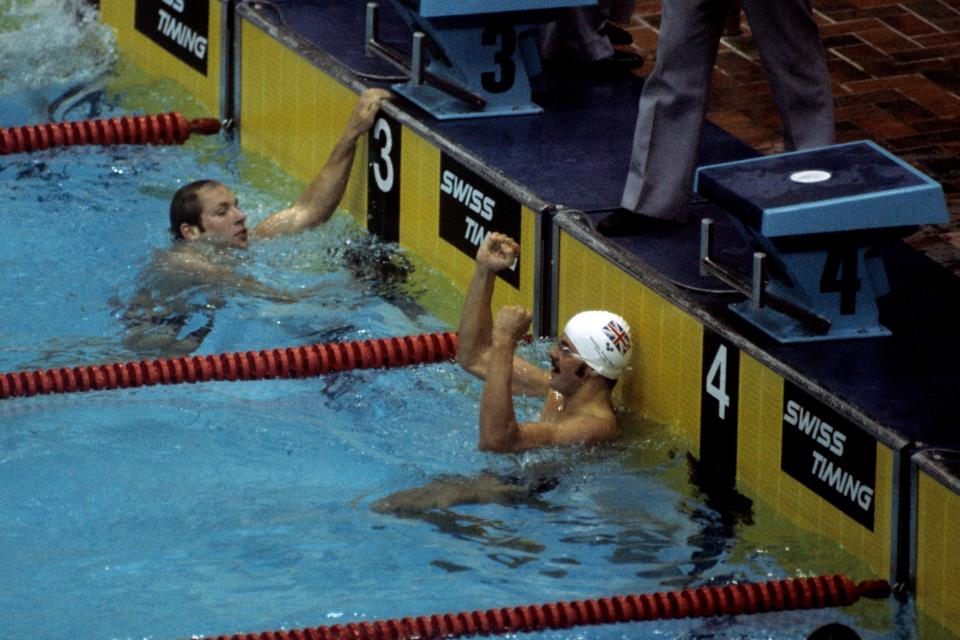 Wilkie celebrates winning gold for Great Britain: his combination of goggles and swimming cap and was pioneering