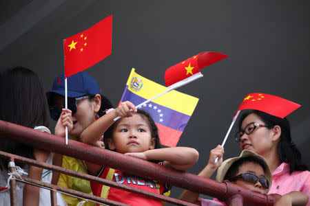 People attend the arrival ceremony of the China's People's Liberation Army (PLA) Navy hospital ship Peace Ark at the port in La Guaira, Venezuela September 22, 2018. REUTERS/Manaure Quintero