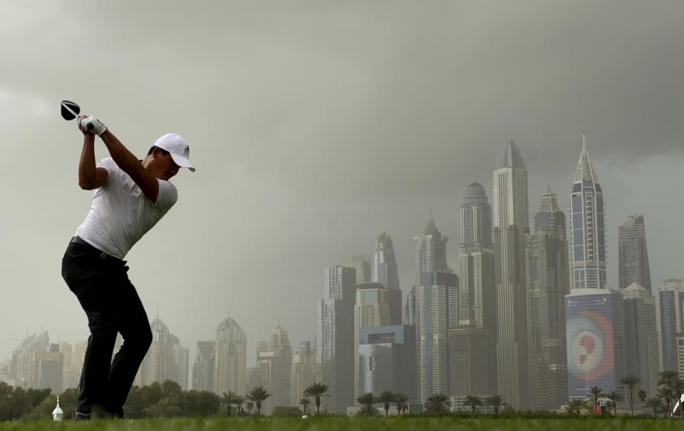 China's Ashun Wu tees off on the 8th hole during the final round of the Dubai Desert Classic golf tournament in Dubai, United Arab Emirates, Sunday, Jan. 26, 2020. (AP Photo/Kamran Jebreili)