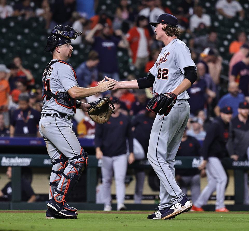 Tigers pitcher Trey Wingenter, right, and catcher Jake Rogers celebrate after the Tigers' 6-3 win on Tuesday, April 4, 2023, in Houston.