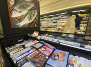 Imported frozen seafood are displayed at a supermarket in Beijing, Friday, Nov. 20, 2020. China has stirred controversy with claims it has detected the coronavirus on packages of imported frozen food. (AP Photo/Ng Han Guan)