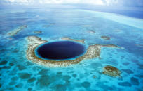 <b>The Great Blue Hole in Belize</b> - A large submarine sinkhole which is over 984 feet across and 407 feet deep. The sinkhole was formed during several episodes of quaternary glaciation when sea levels were much lower. (Kurt Amsler/Ardea/Caters News)