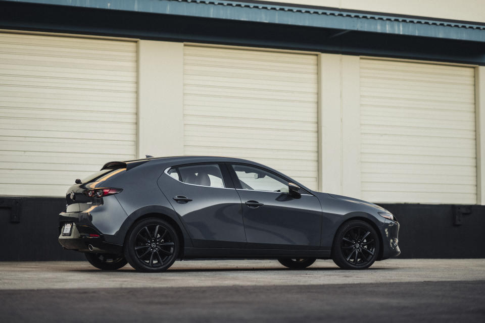 This photo provided by Mazda shows the 2021 Mazda 3. The 3 is attractively styled and uncommonly sporty for a small sedan or hatchback. (Courtesy of Mazda North American Operations via AP)