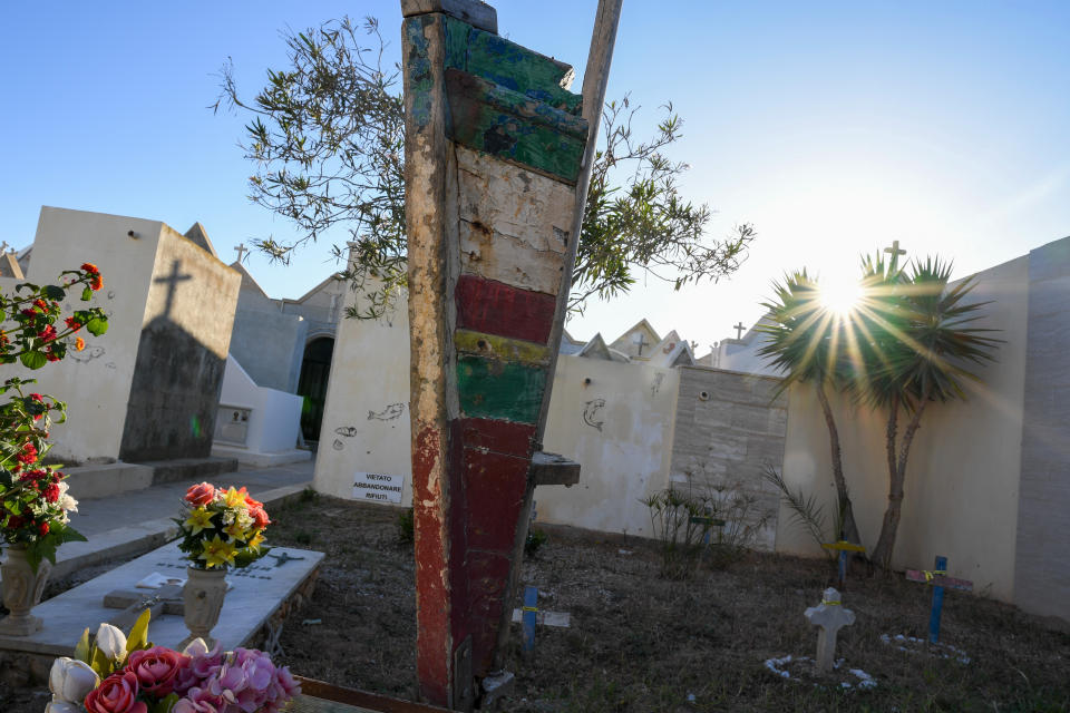 The sun shines over the cemetery where victims of shipwrecks are buried, in the Island of Lampedusa, southern Italy, Thursday, May 13, 2021. Lampedusa is closer to Africa than the Italian mainland, and it has long been the destination of choice for migrant smuggling operations leaving Libya. Over the years, it has witnessed countless numbers of shipwrecks and seen bodies floating offshore, only to be buried in the cemetery on land. (AP Photo/Salvatore Cavalli)