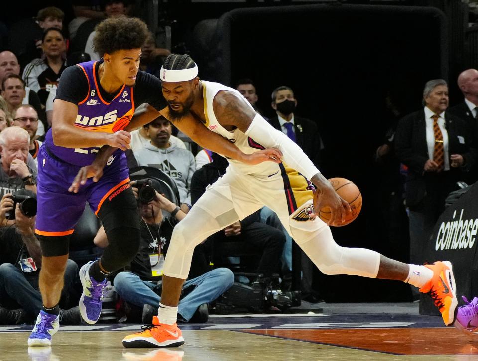 October 28, 2022; Phoenix, Ariz; USA; Suns foward Cam Johnson (23) defends Pelicans forward Naji Marshall (8) during a game at the Footprint Center. Mandatory Credit: Patrick Breen-Arizona Republic