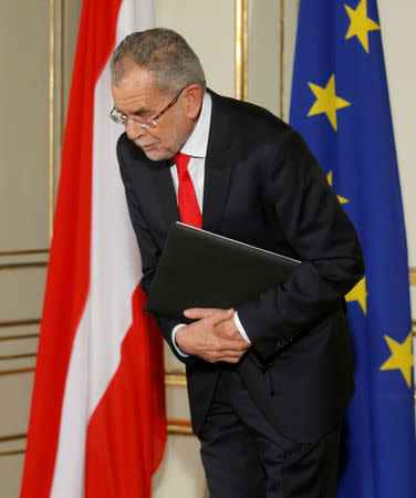 Austrian President-elect Alexander Van der Bellen leaves a news conference in Vienna, Austria, December 6, 2016. REUTERS/Heinz-Peter Bader