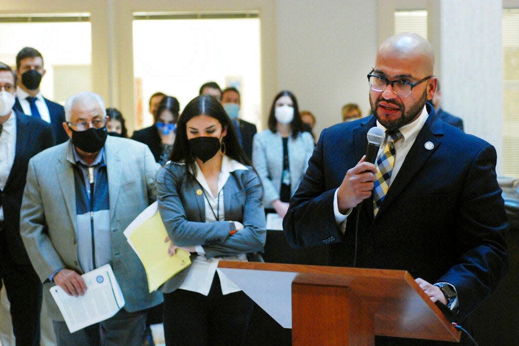 New Mexico legislators including Democratic state Rep. Javier MartÃ­nez of Albuquerque, foreground, proposed a $1 billion increase in general fund spending for the coming fiscal year, at a news conference in Santa Fe, N.M., on Thursday, Jan. 6, 2022. The proposed 14% boost is aimed at shoring up access to health care, improving public education and providing new investments in child welfare and public safety. A separate proposal from Gov. Michelle Lujan Grisham shares many spending priorities.