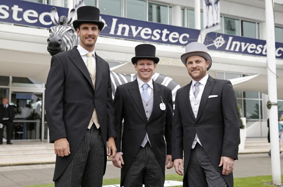 England cricketers Steven Finn, Eoin Morgan and New Zealand's Brendon McCullum pose before the days racing