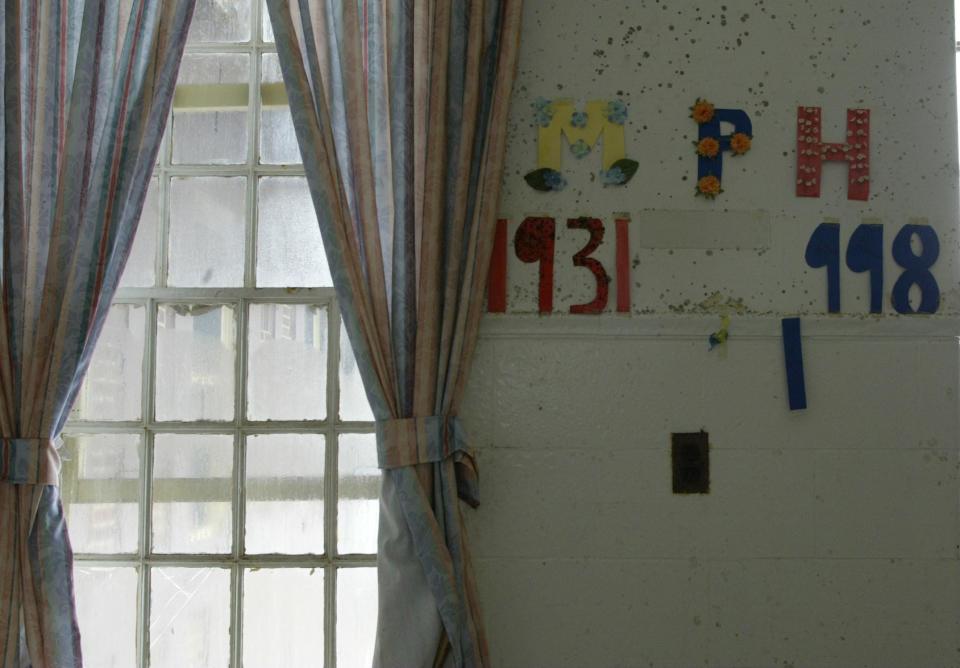 A sign on the wall inside what used to be the main building at Marlboro Psychiatric Hospital, seen in 2009, a few years before the abandoned institution was torn down.