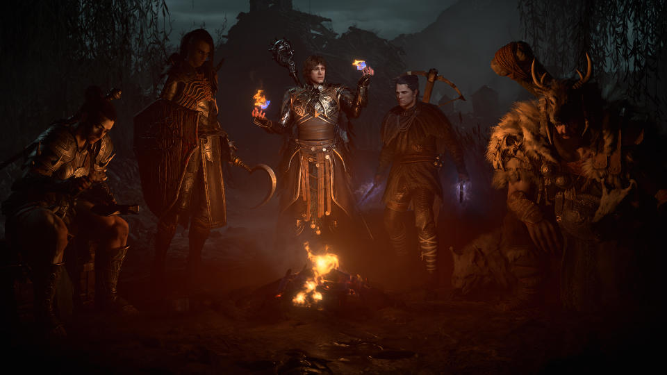 Characters gathered around a fire in Diablo 4