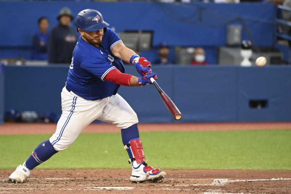 Toronto Blue Jays' Alejandro Kirk hits a double in the fifth inning of a baseball game against the Boston Red Sox in Toronto, Monday, June 27, 2022. (Jon Blacker/The Canadian Press via AP)