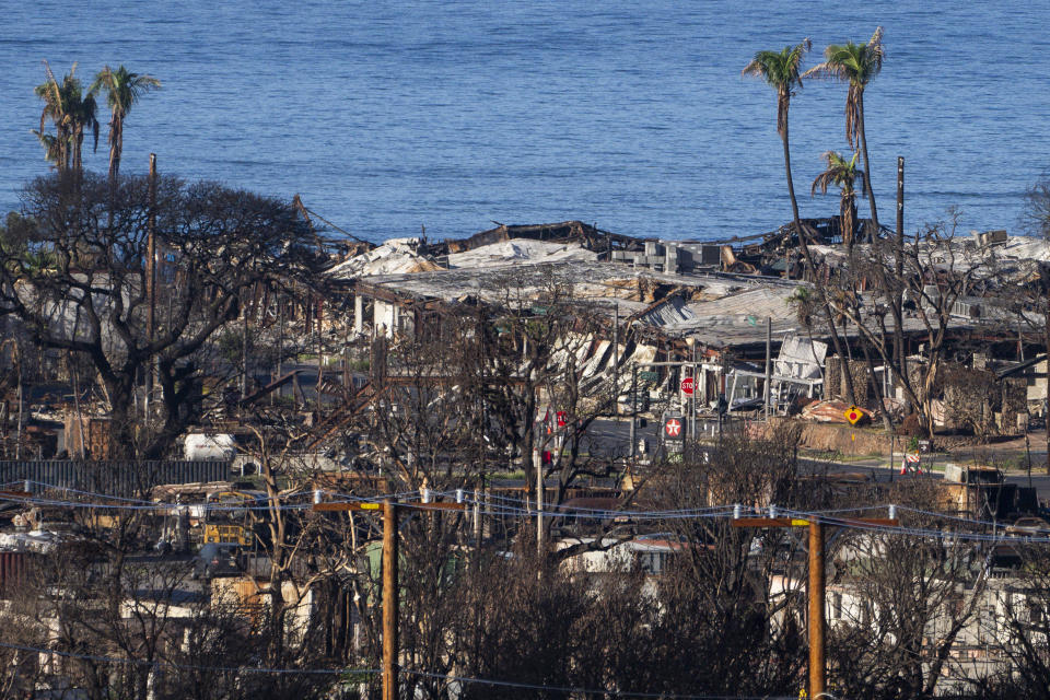 Destroyed homes and businesses are seen Wednesday, Dec. 6, 2023, in Lahaina, Hawaii. Recovery efforts continue after the August wildfire that swept through the Lahaina community on the Hawaiian island of Maui, the deadliest U.S. wildfire in more than a century. (AP Photo/Lindsey Wasson)