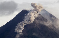 Hot cloud of volcanic materials run down the slope of Mount Merapi during an eruption in Sleman, Wednesday, Jan. 27, 2021. Indonesia's most active volcano erupted Wednesday with a river of lava and searing gas clouds flowing 1,500 meters (4,900 feet) down its slopes. (AP Photo/Slamet Riyadi)