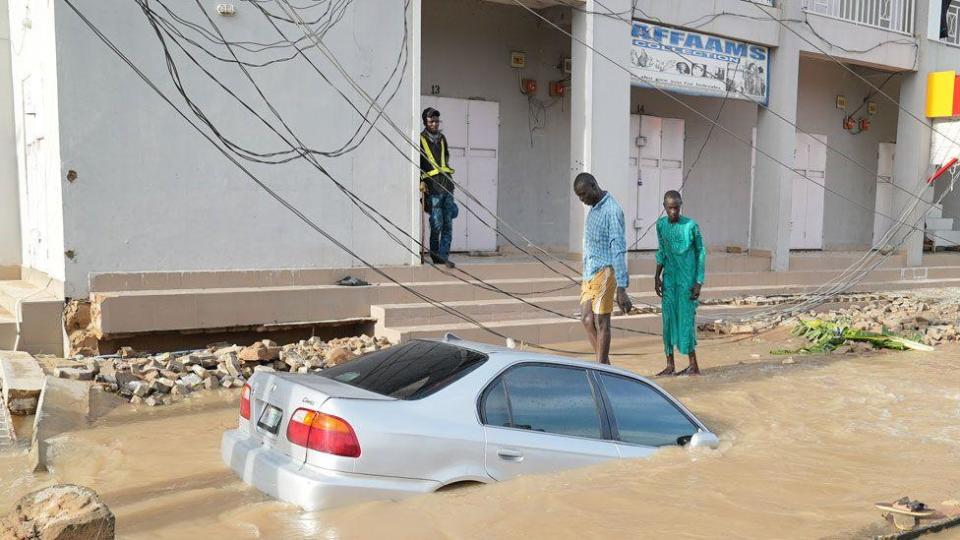 A car sunk in flood water in Maiduguri, Nigeria