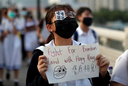 Anti-government protesters form a human chain in Hong Kong