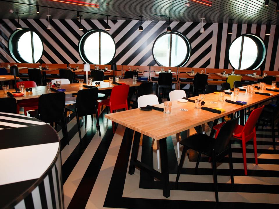 The Razzle Dazzle restaurant with bold white and black stripes on the wall and floor