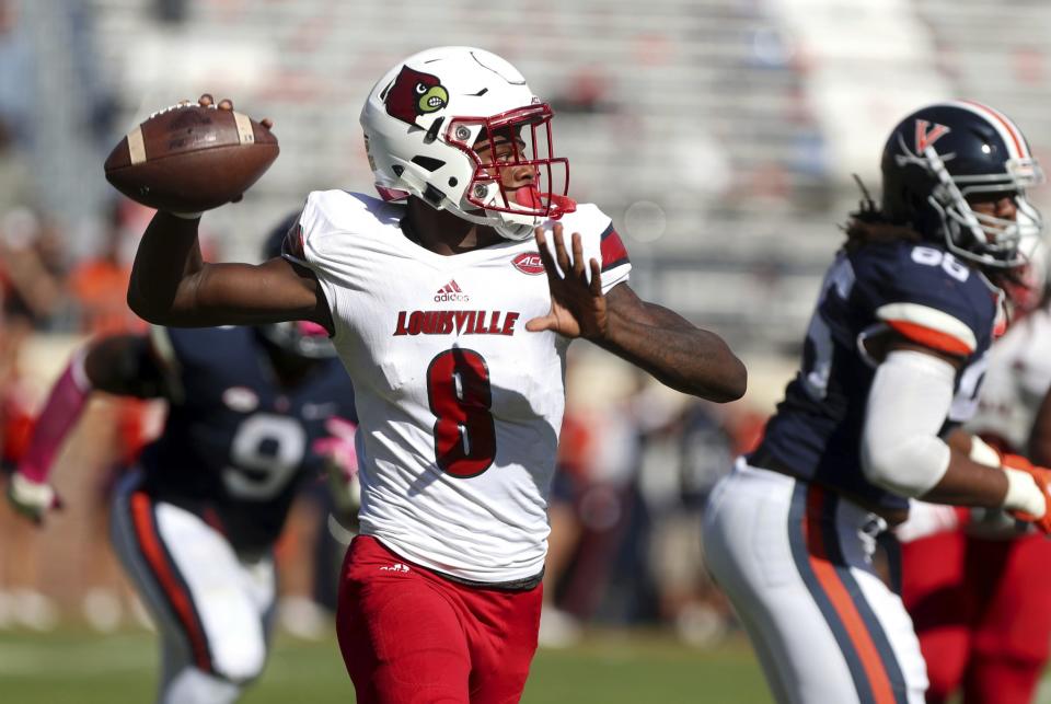 Lamar Jackson's last minute TD pass helped Louisville beat Virginia. (AP Photo/Ryan M. Kelly)