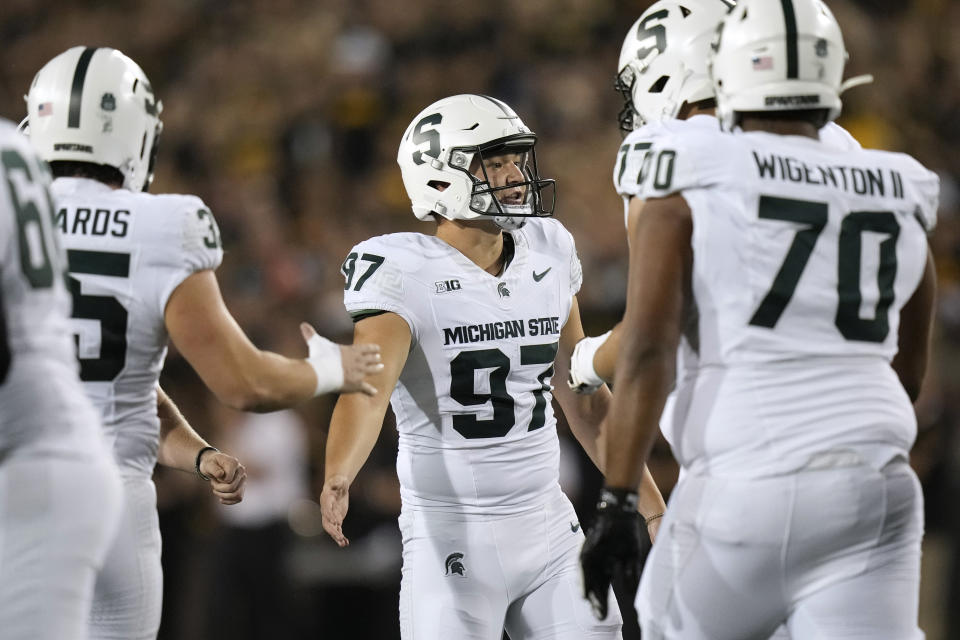 Michigan State place-kicker Jonathan Kim (97) celebrates with teammates after kicking a field goal during the first half of an NCAA college football game against Iowa, Saturday, Sept. 30, 2023, in Iowa City, Iowa. (AP Photo/Charlie Neibergall)