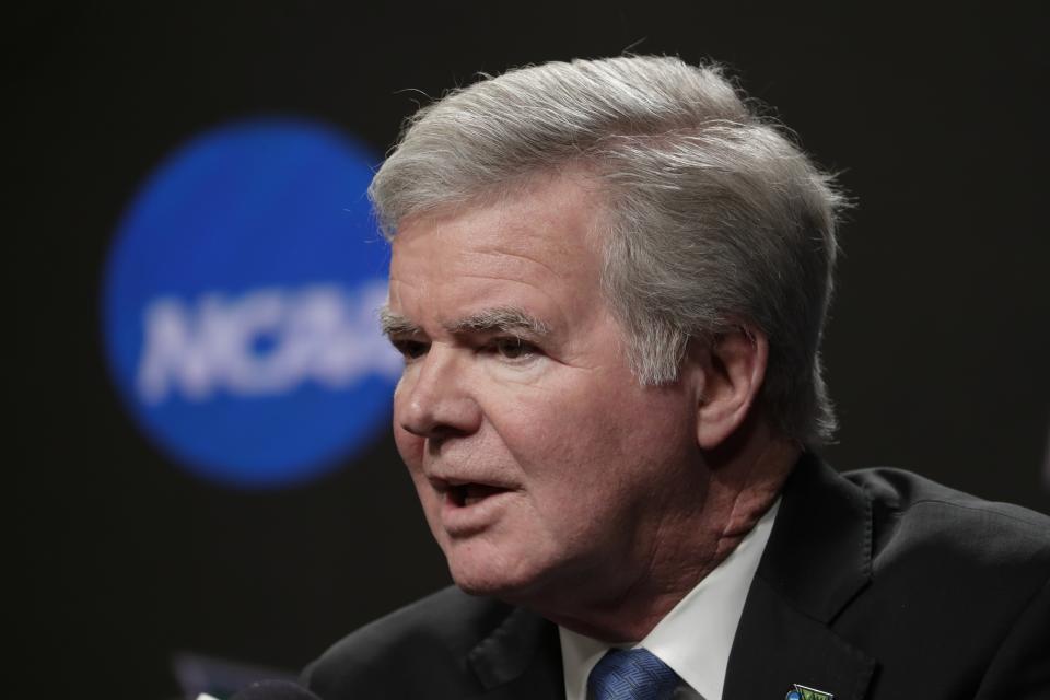 FILE - In this April 4, 2019, file photo, NCAA President Mark Emmert answers questions at a news conference at the Final Four college basketball tournament in Minneapolis. Emmert says it is “highly probably” federal legislation will pass that sets national guidelines for how college athletes can be compensated for the their names, images and likenesses. Emmert spoke Wednesday, Dec. 11, 2019, at the Learfield/IMG Intercollegiate Athletic Forum sponsored by the Sports Business Journal, in New York. (AP Photo/Matt York, File)
