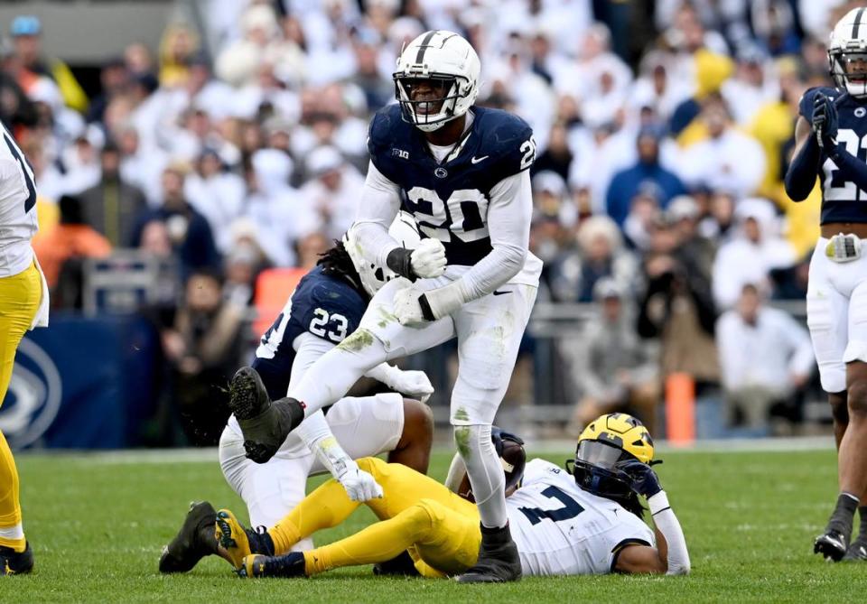Penn State defensive end Adisa Isaac celebrates his stop of Michigan’s Donovan Edwards during the game against Michigan on Saturday, Nov. 11, 2023. Abby Drey/adrey@centredaily.com