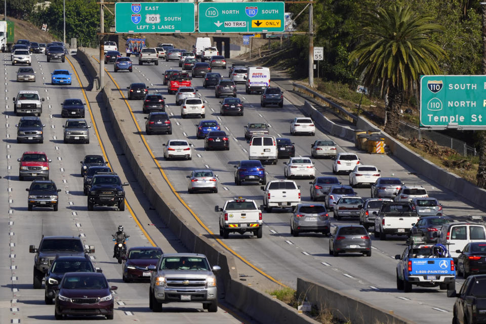FILE - Cars drive on the Hollywood Freeway (U.S. 101) in Los Angeles, April 16, 2020. New vehicles sold in the U.S. will have to average about 38 miles per gallon of gasoline in 2031 in real world driving, up from about 29 mpg this year, under new federal rules unveiled Friday, June 7, 2024, by the Biden administration. President Joe Biden has set a goal that half all of new vehicles sold in the U.S. in 2030 are electric. (AP Photo/Mark J. Terrill, File)