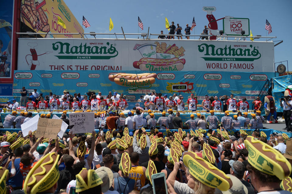 <p>Competitors ready themselves for the start of the Nathan’s Famous Fourth of July International Hot Dog-Eating Contest at Coney Island in Brooklyn, New York City, U.S., July 4, 2017. (Erik Pendzich/REX/Shutterstock) </p>