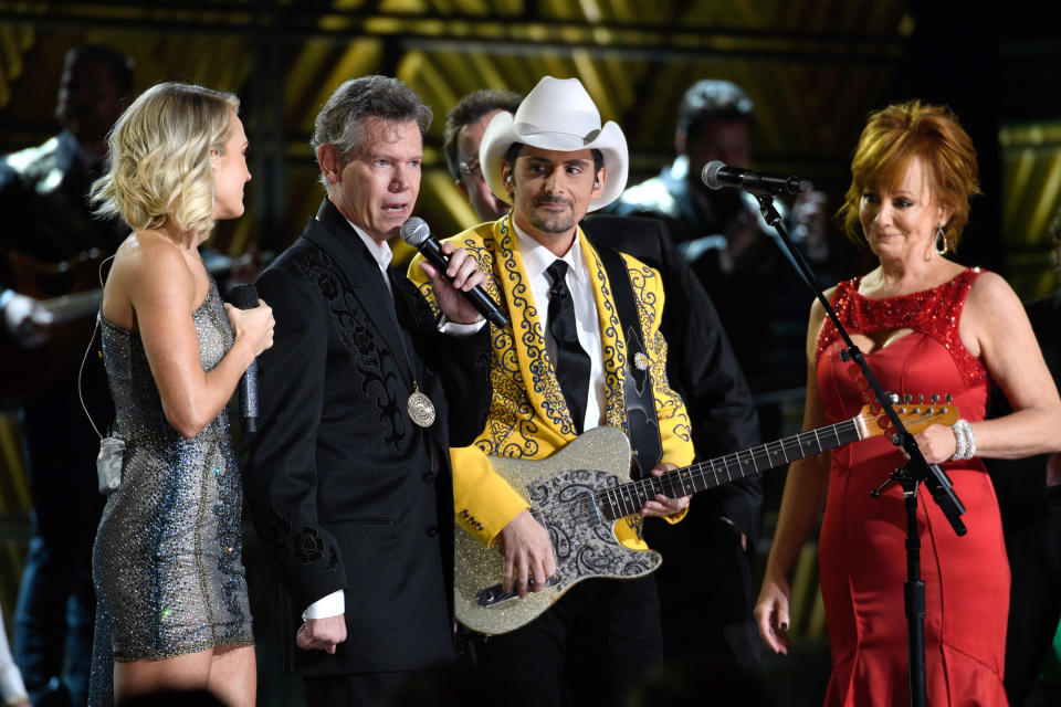 THE 50th ANNUAL CMA AWARDS - The 50th Annual CMA Awards, hosted by Brad Paisley and Carrie Underwood, broadcasts live from the Bridgestone Arena in Nashville, Wednesday, November 2 (8:00-11:00 p.m. EDT), on the ABC Television Network. (Image Group LA/ABC via Getty Images) CARRIE UNDERWOOD, RANDY TRAVIS, BRAD PAISLEY, REBA MCENTIRE