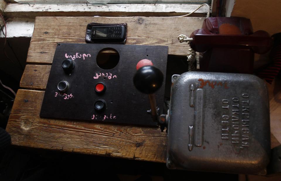 Cable car control devices are seen inside an operator's booth in the town of Chiatura
