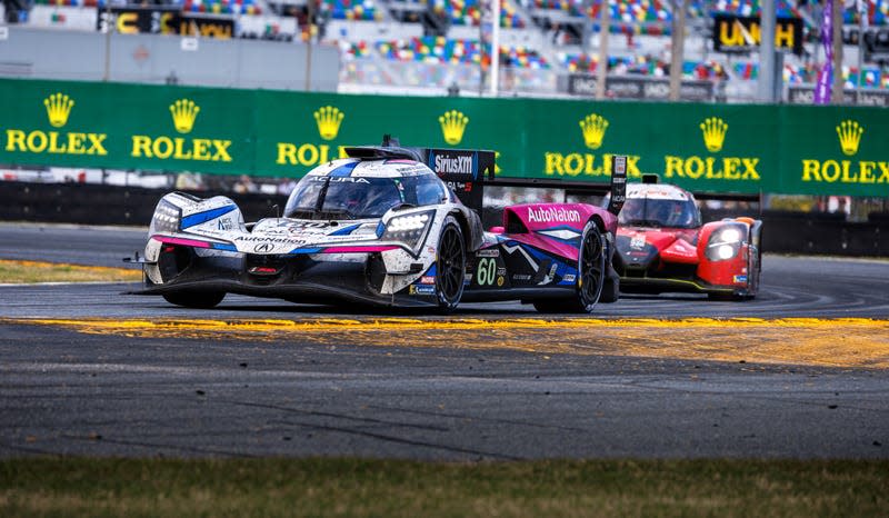 The No. 60 Meyer Shank Racing Acura hypercar on track at Daytona International Speedway.