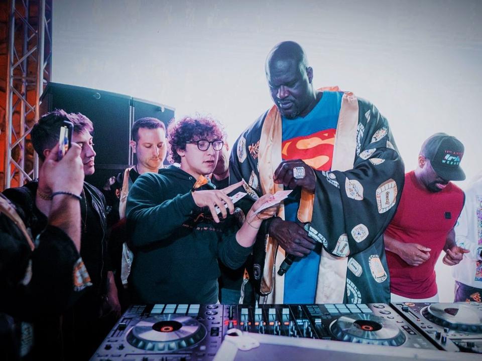 Julius Dein doing magic for Shaquille O'Neal.