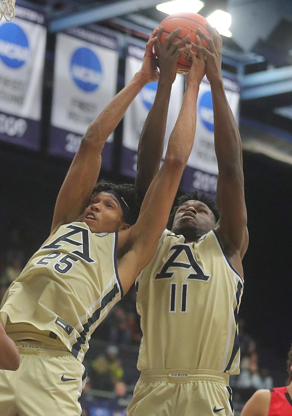 University of Akron's Enrique Freeman, left, and Sammy Hunter grab a rebound against Gardner-Webb on Thursday, Dec. 21, 2023.