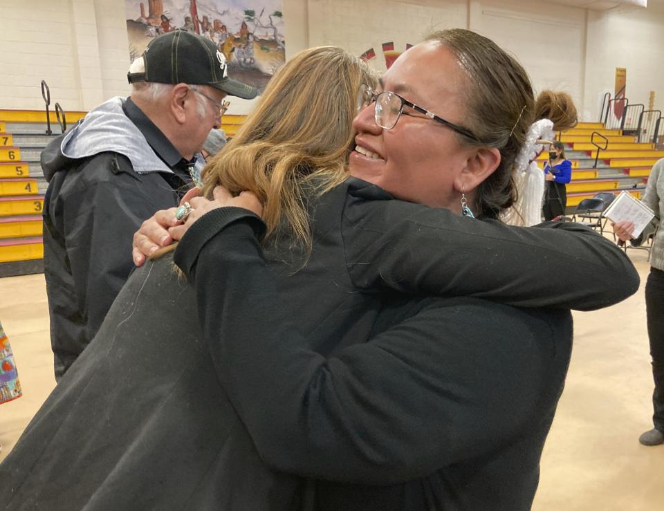 This Feb. 17, 2023 image shows chief school administrator Willinda Castillo hugging U.S. Rep. Melanie Stansbury of New Mexico following a celebration of $90 million in federal funds for a new school at To'Hajiilee, New Mexico. The school is just one of dozens funded by the U.S. Bureau of Indian Education that are in desperate need of repair or replacement. The agency estimates it would cost roughly $6.2 billion to address the needs of those schools in poor condition. (AP Photo/Susan Montoya Bryan)