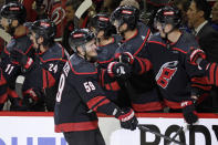 Carolina Hurricanes center Jake Guentzel (59) is congratulated for a goal against the New York Rangers during the first period in Game 3 of an NHL hockey Stanley Cup second-round playoff series Thursday, May 9, 2024, in Raleigh, N.C. (AP Photo/Chris Seward)