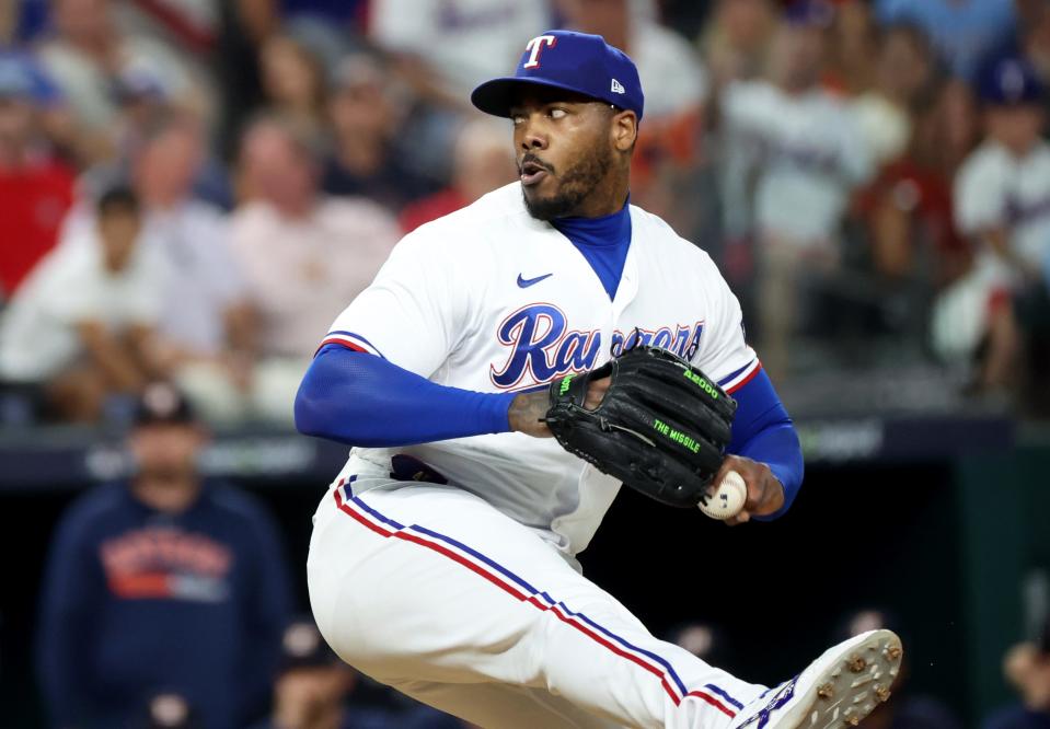 Texas Rangers pitcher Aroldis Chapman (45) throws during the eighth inning of game five in the ALCS against the Houston Astros for the 2023 MLB playoffs at Globe Life Field in Arlington, Texas on Oct. 20, 2023.